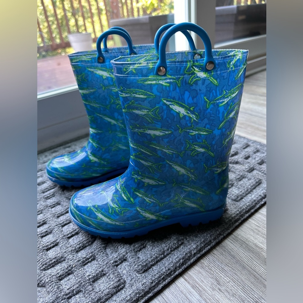 Like new, size 2, blue shark rain boots. Brand is Zoogs.